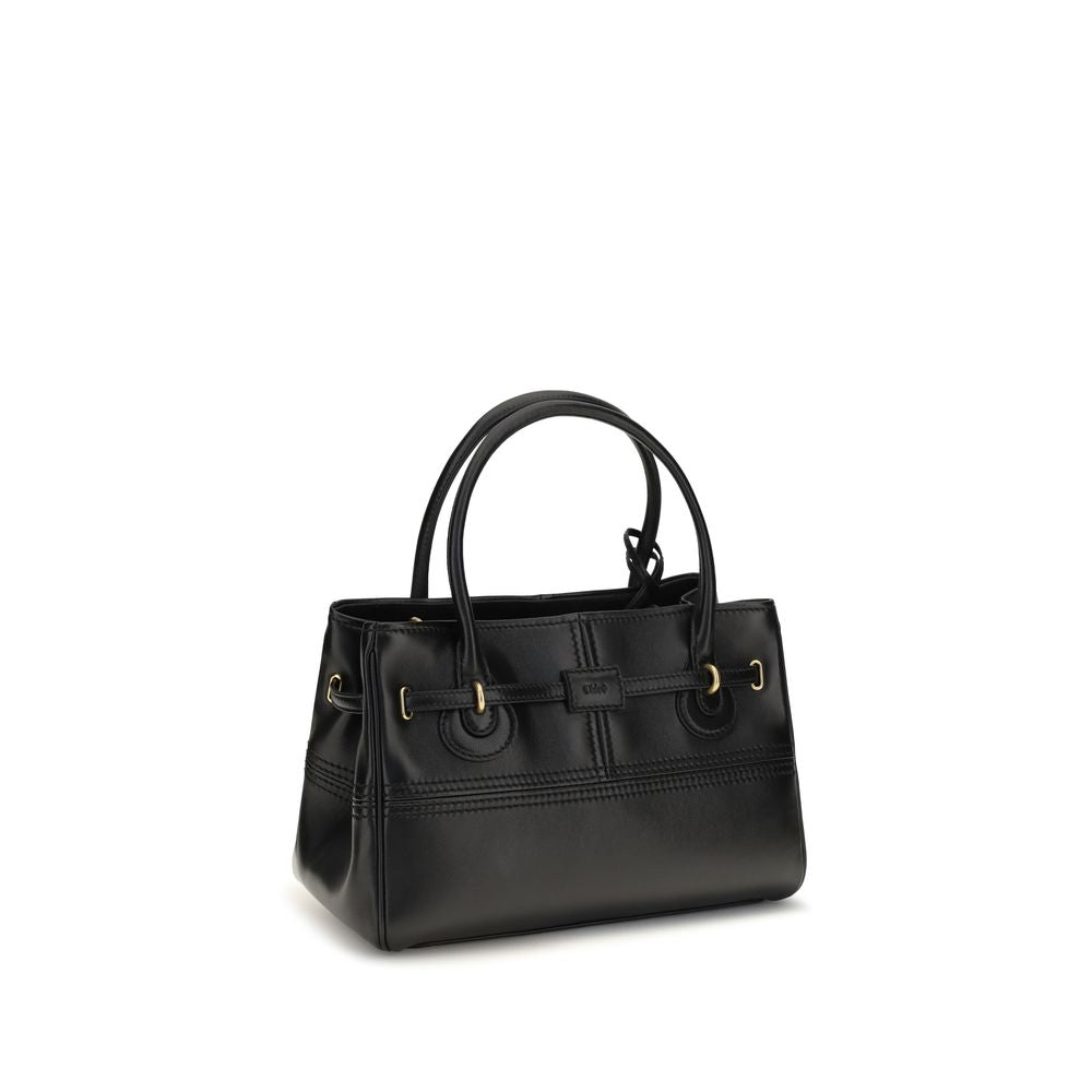 Indulge in the Chloé Black Buffalo Leather Shoulder Bag, a masterpiece of luxurious craftsmanship celebrating 20 years of timeless elegance and sophistication.
