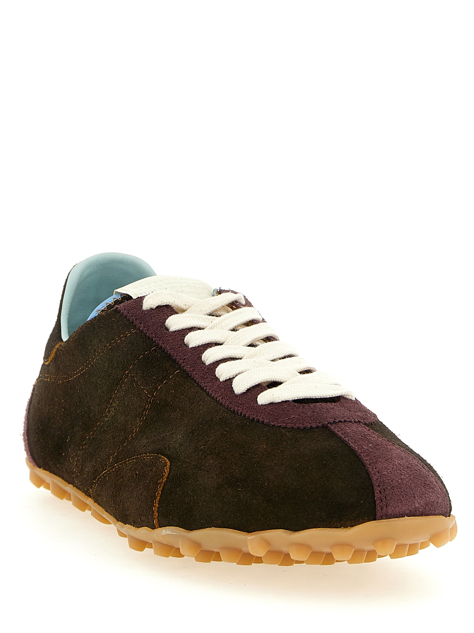 Elevate your style with Maison Margiela's Brown Calfskin Athletic Sneakers, where artisanal craftsmanship meets luxurious comfort, perfect for the discerning individual.
