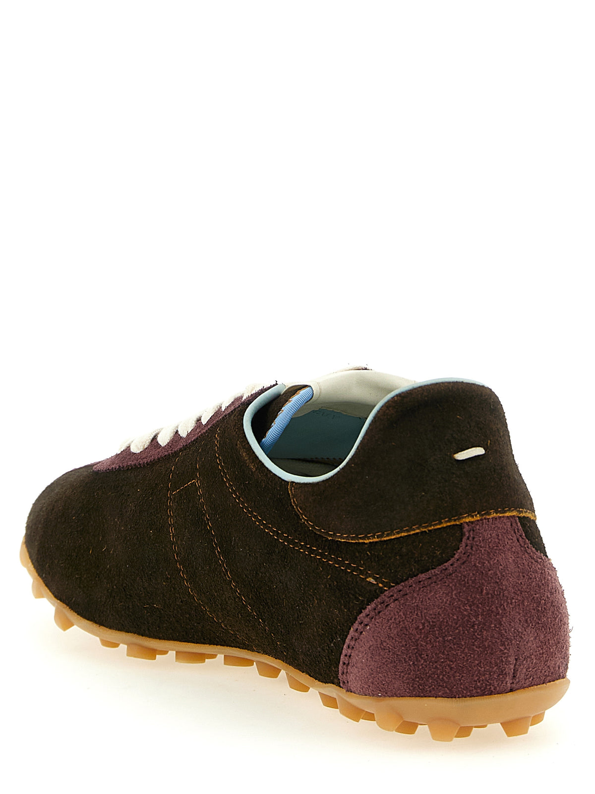 Discover Maison Margiela's Sprinters sneakers, where artisanal craftsmanship meets luxurious suede and striking accents, elevating your style with unparalleled sophistication.