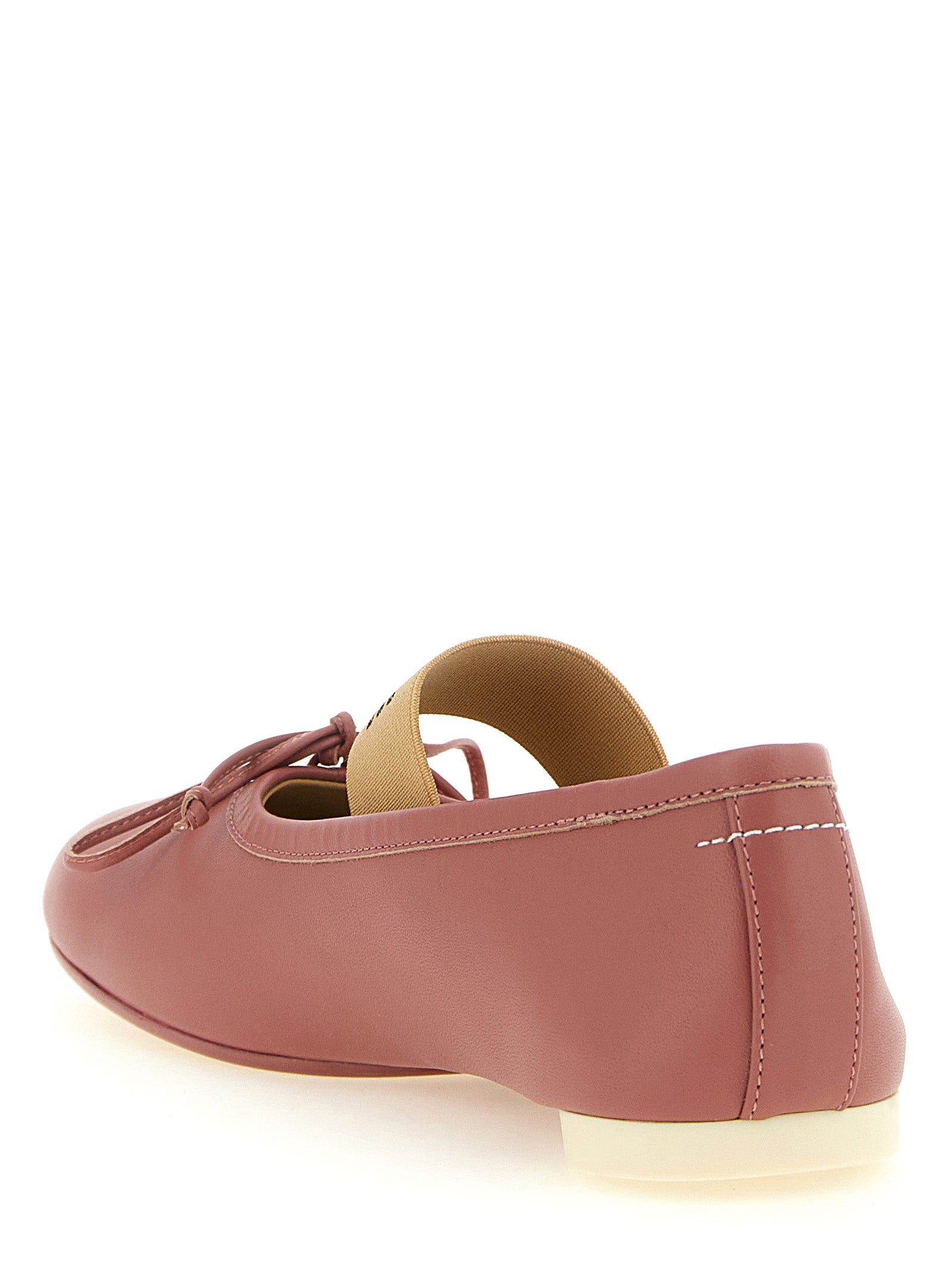 Elevate your style with MM6 Maison Margiela's exquisite lambskin ballet flats, a harmonious blend of avant-garde design and luxurious craftsmanship, perfect for the discerning individual.