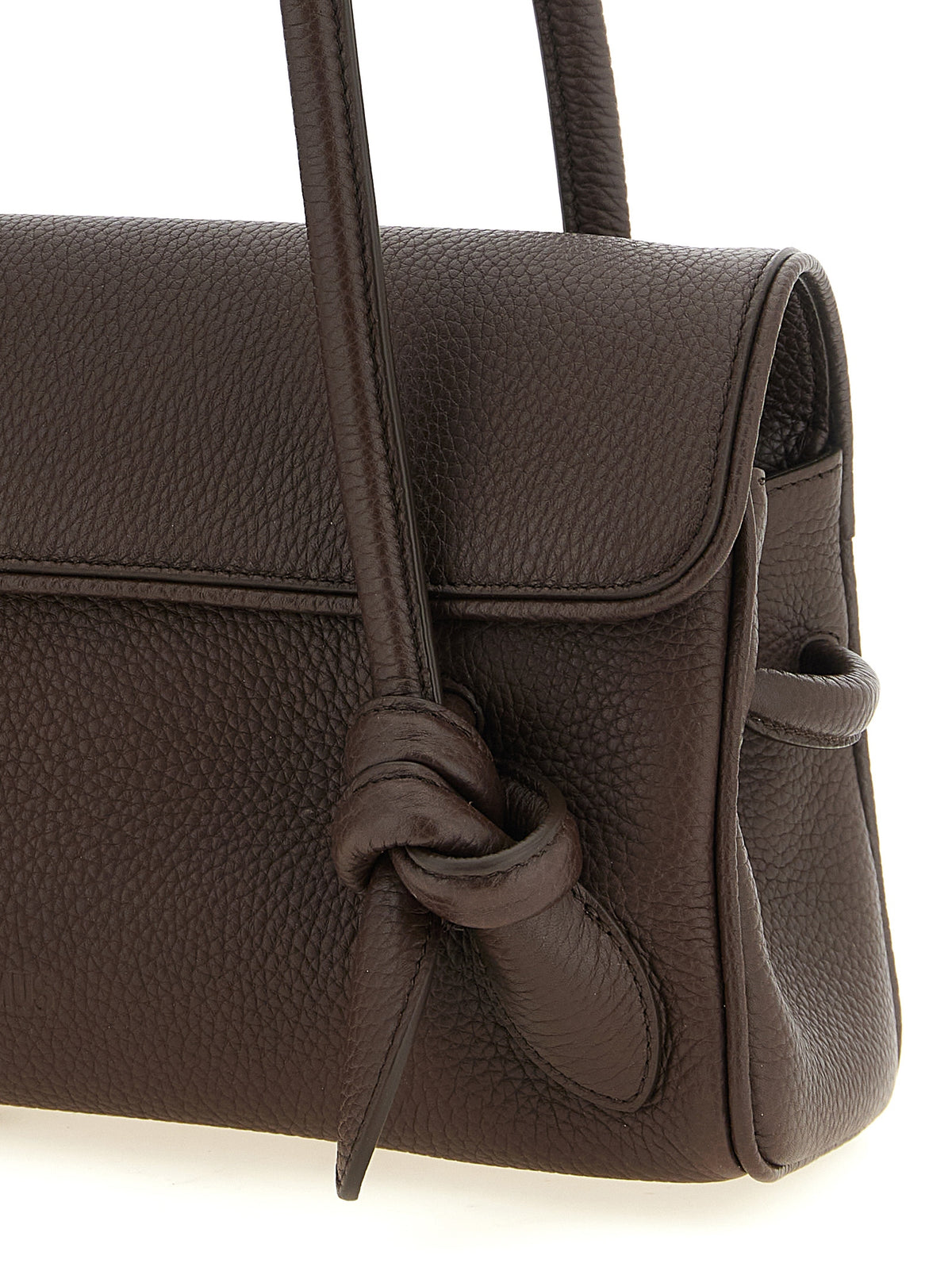 Elevate your style with the Jacquemus Brown Calfskin Shoulder Bag, a timeless Italian masterpiece crafted from exquisite hammered leather, embodying bold sophistication and refined elegance.