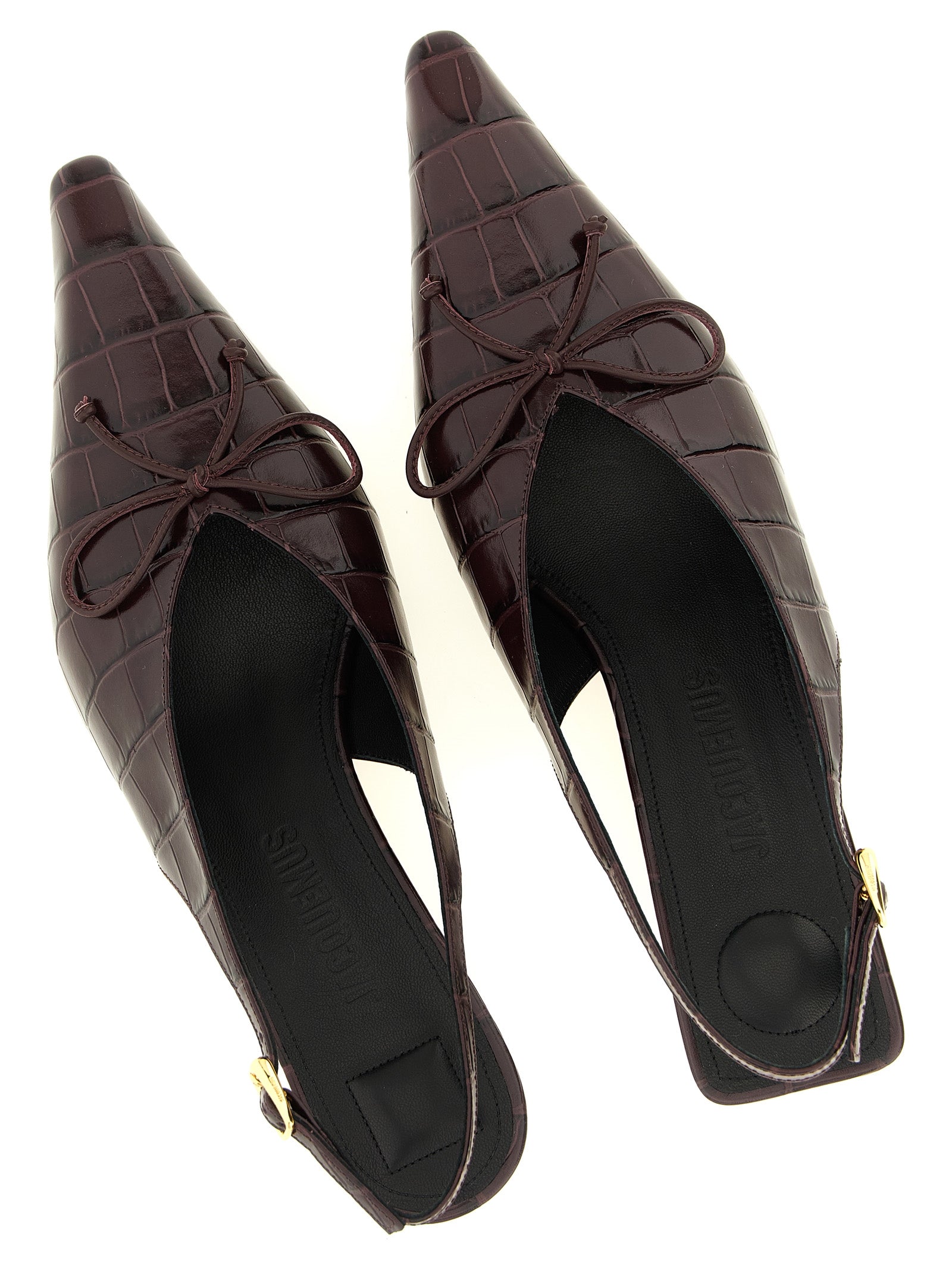 Indulge in the exquisite Jacquemus Bordeaux Calfskin Mid Heel Pumps, where bold design meets luxurious craftsmanship, elevating every step with sophistication and allure.