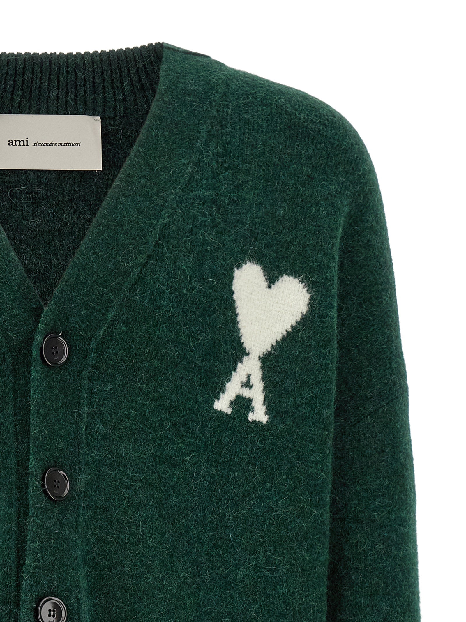 Indulge in the exquisite AMI Paris Bicolor Alpaca Leather Cardigan, where luxurious alpaca and wool blend seamlessly, embodying sophistication and timeless elegance.