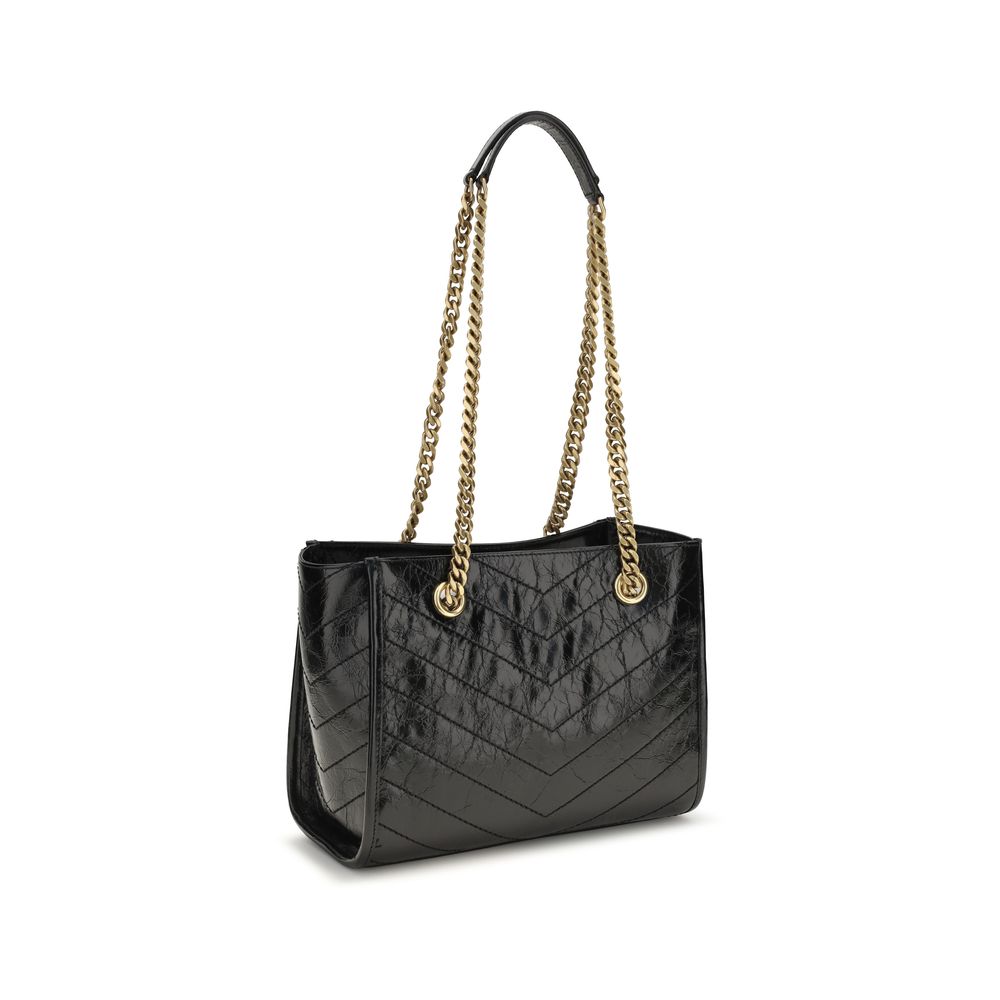 Discover the Saint Laurent Black Calf Leather Bos Taurus Shoulder Bag, a masterpiece of vintage craftsmanship and timeless elegance, perfect for the discerning individual.
