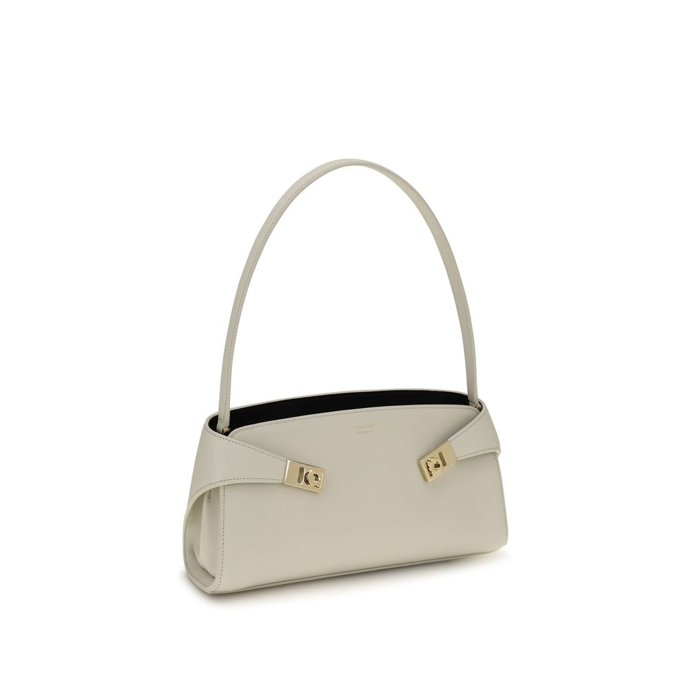 Discover the Ferragamo Beige Calf Leather Bos Taurus Shoulder Bag, a luxurious blend of craftsmanship and style, perfect for those who appreciate refined elegance.