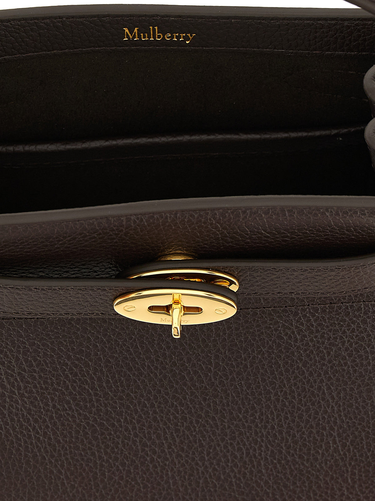 Discover the Mulberry Islington small bucket bag, a masterpiece of hammered calf leather, exuding timeless elegance and sophistication for the discerning individual.