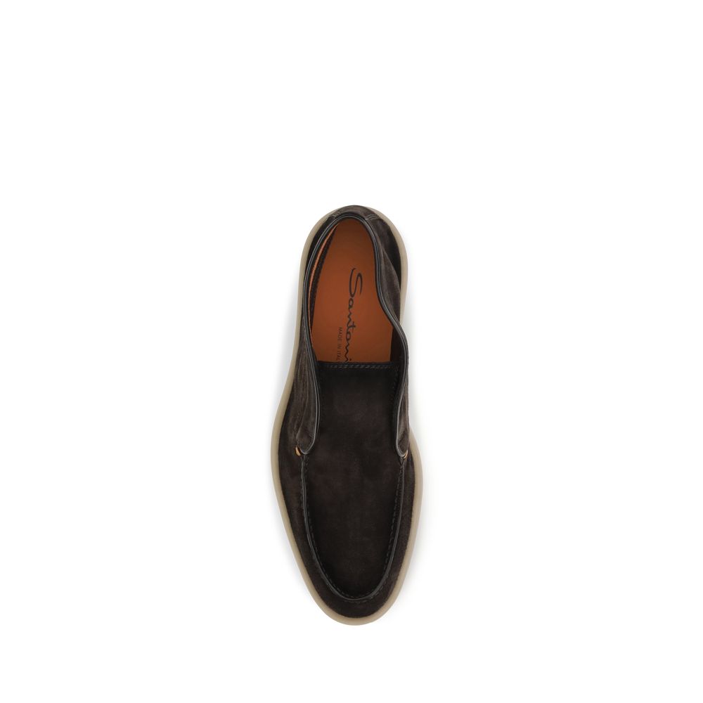 Indulge in the exquisite craftsmanship of Santoni's Brown Suede Leather Slip-On Loafers, where luxurious suede meets timeless design for the discerning individual.