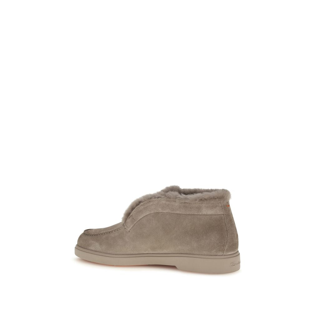 Indulge in the exquisite allure of Santoni's Beige Faux Fur Ankle Boots, where soft calf suede meets cruelty-free luxury, defining sophistication for the discerning individual.