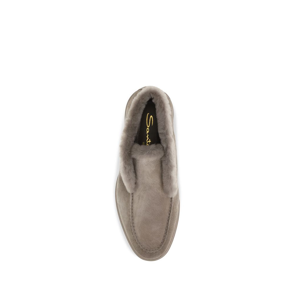 Indulge in the exquisite allure of Santoni's Beige Faux Fur Ankle Boots, crafted from sumptuous calf suede and cruelty-free fur, embodying timeless elegance and sophistication.