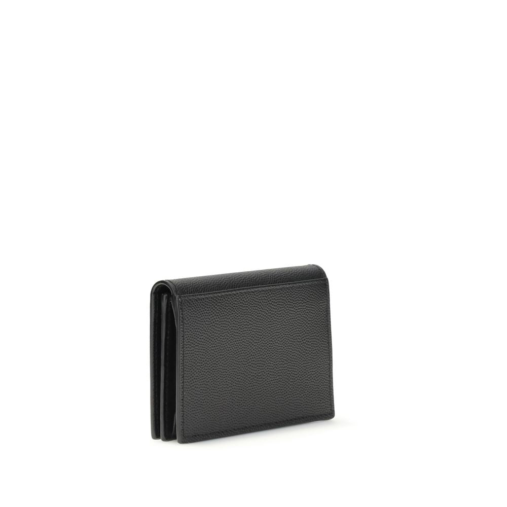 Indulge in the elegance of the Saint Laurent Black Calf Leather Bos Taurus Wallet, a masterpiece of craftsmanship that embodies luxury and sophistication for discerning individuals.