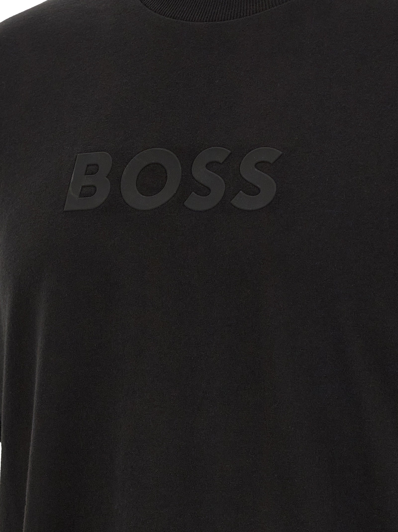 Discover the HUGO BOSS Black Cotton T-Shirt, a testament to modern luxury with its pure cotton fabric and embossed logo, perfect for those who embrace elegance and sophistication.