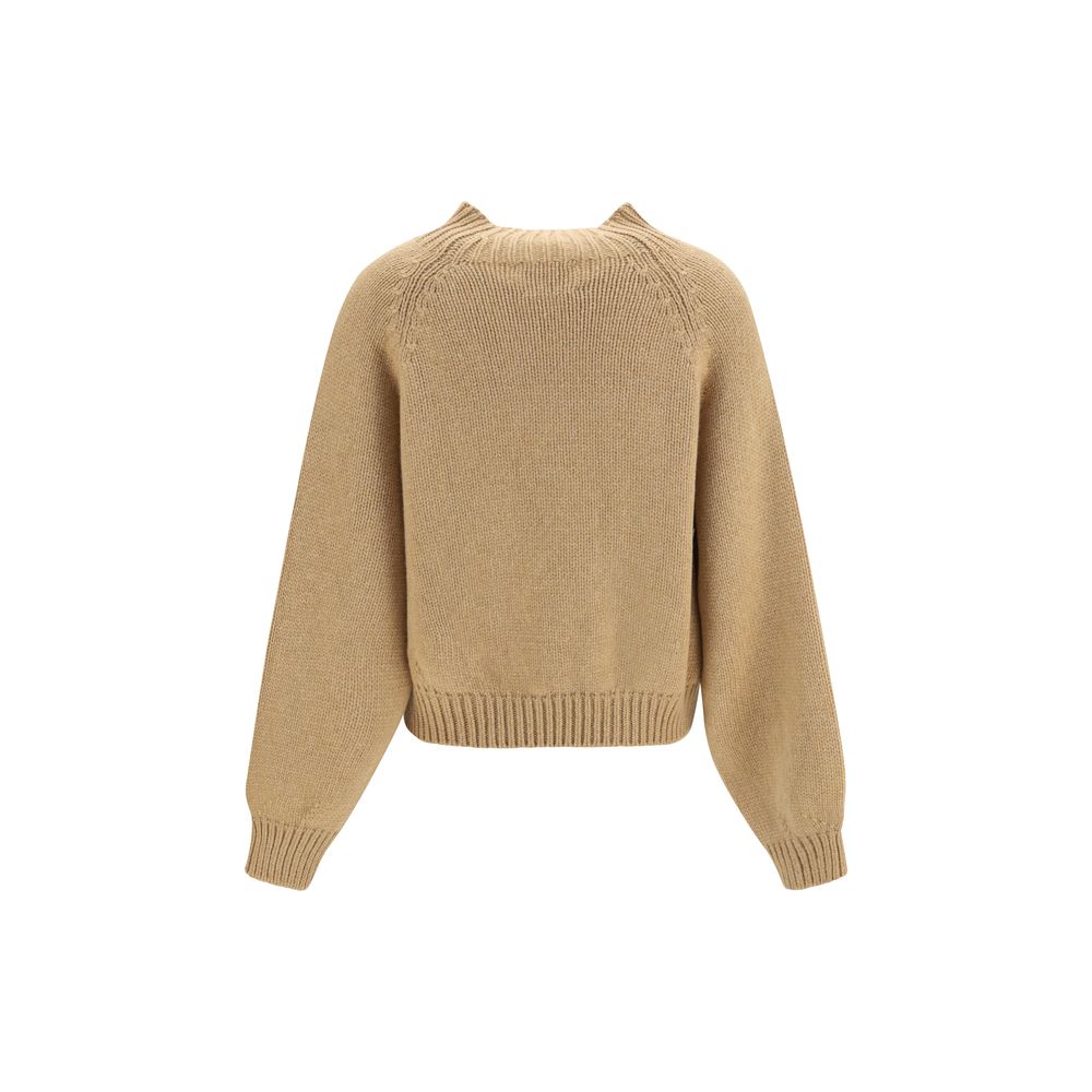 Indulge in the exquisite Khaite Beige Cashmere Sweater, crafted from luxurious Italian cashmere, embodying refined elegance and timeless sophistication for the discerning individual.