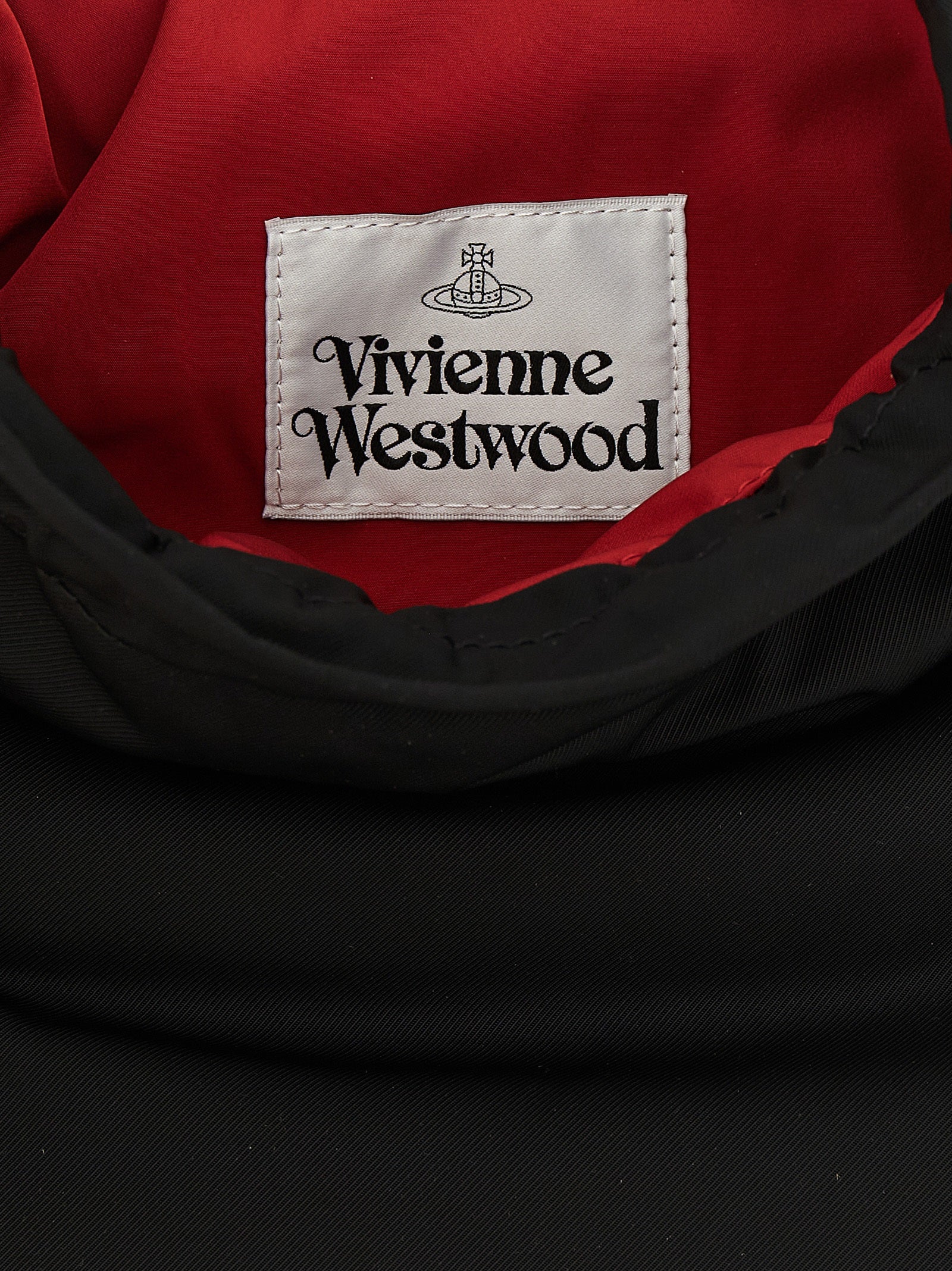 Discover the Vivienne Westwood Black Polyester Clutch Bag, a statement of elegance crafted from luxurious tech fabric, perfect for the discerning fashion connoisseur.