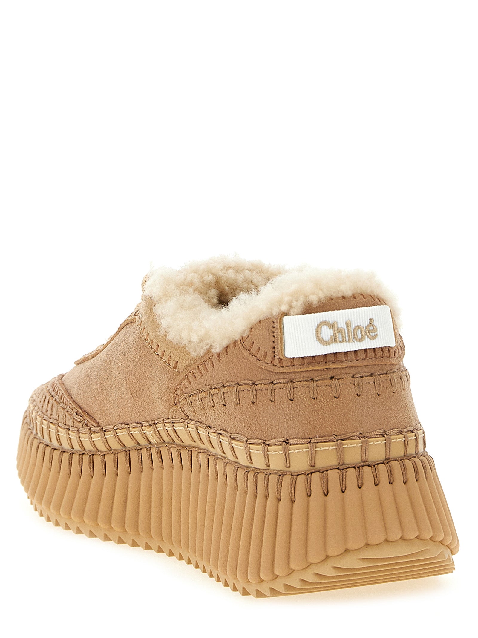 Step into elegance with Chloé's Beige Lambskin Chunky Sneakers, where luxurious craftsmanship meets sustainable design, elevating your style with every step.