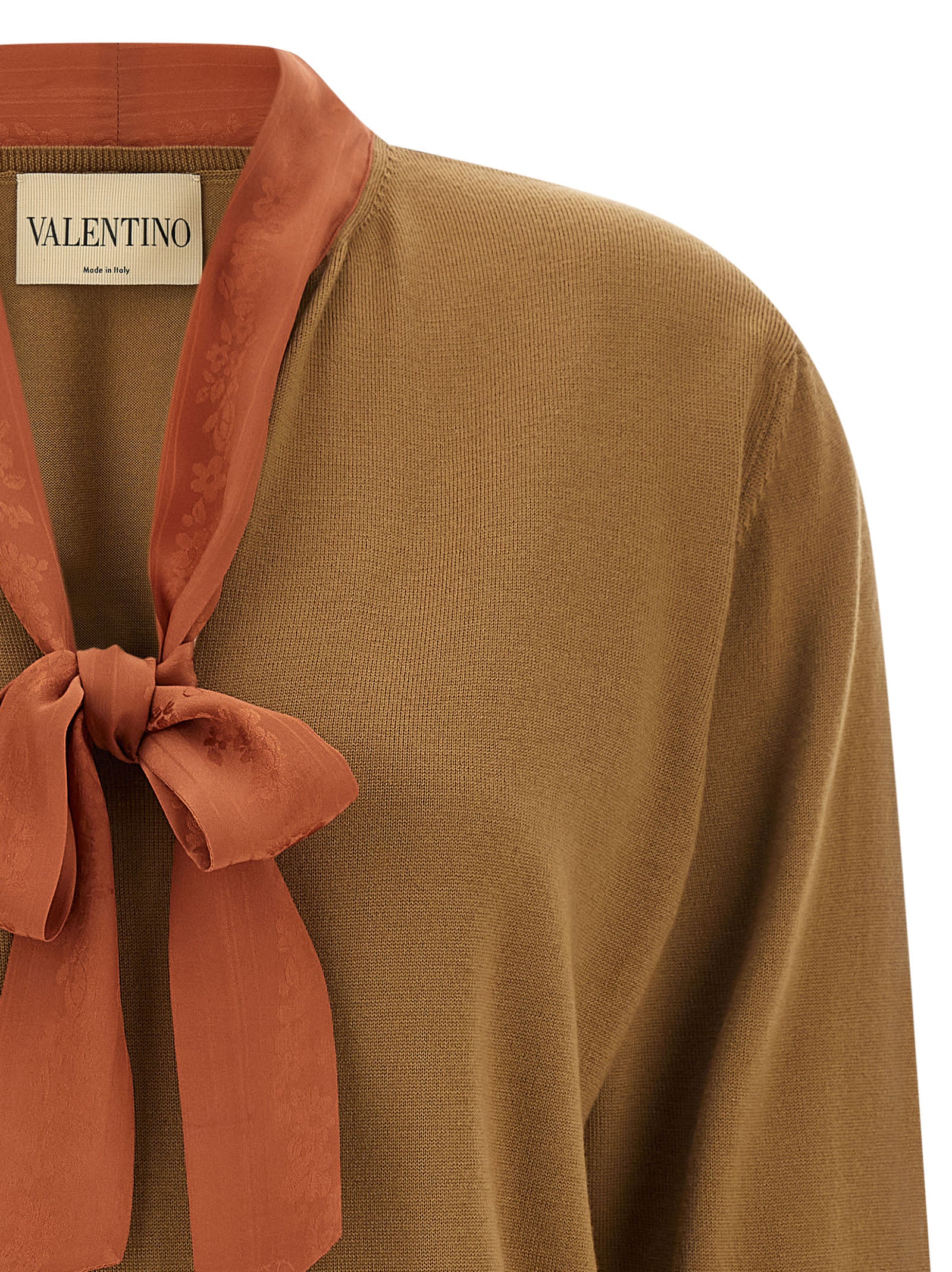 Indulge in the elegance of the Valentino Garavani Brown Cashmere Cardigan, a timeless piece crafted from luxurious cashmere, perfect for elevating any sophisticated wardrobe.