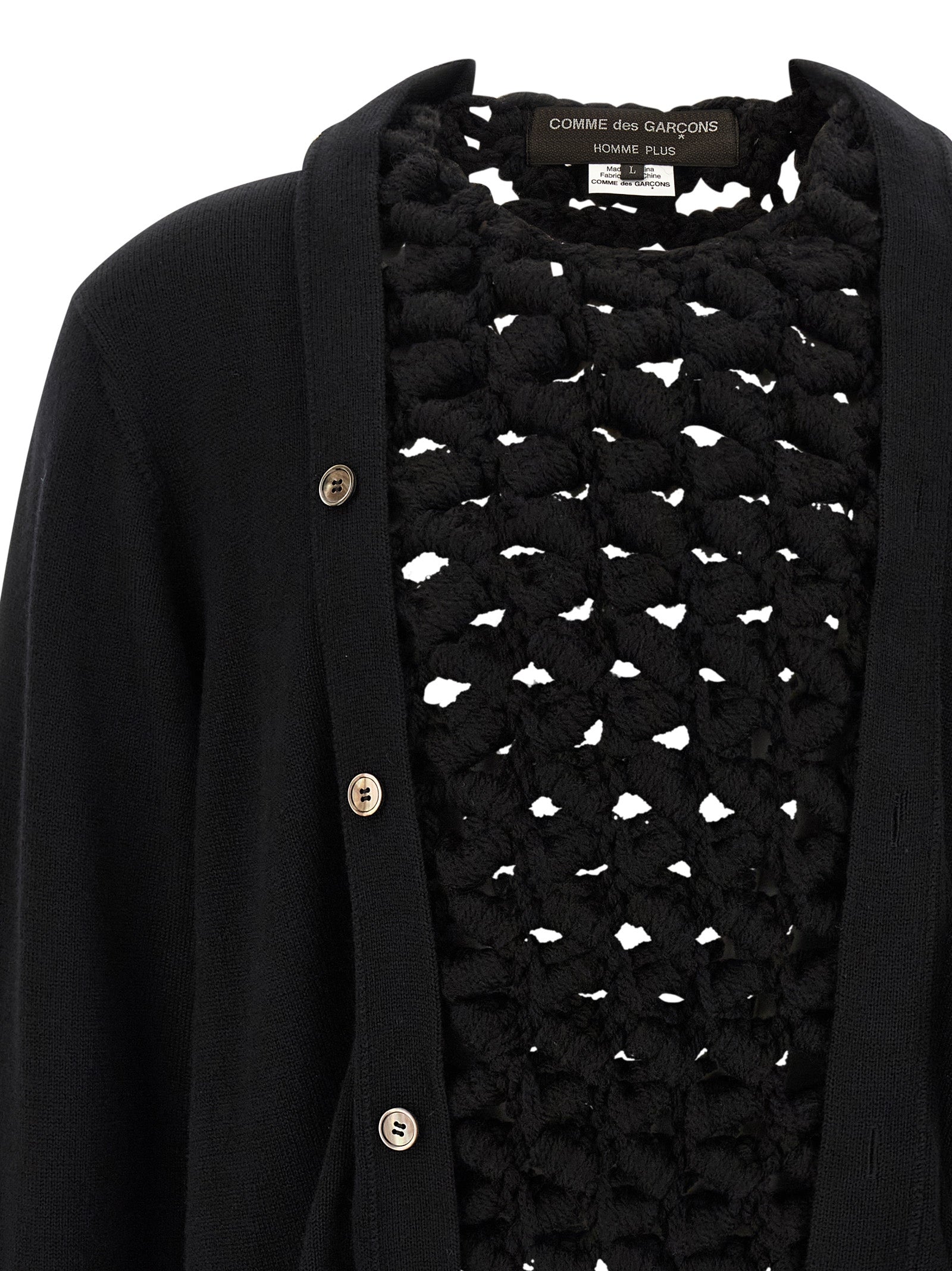 Indulge in the avant-garde elegance of the Comme Des Garçons Black Wool Cardigan, a masterpiece of Japanese craftsmanship that redefines luxury knitwear for discerning tastes.