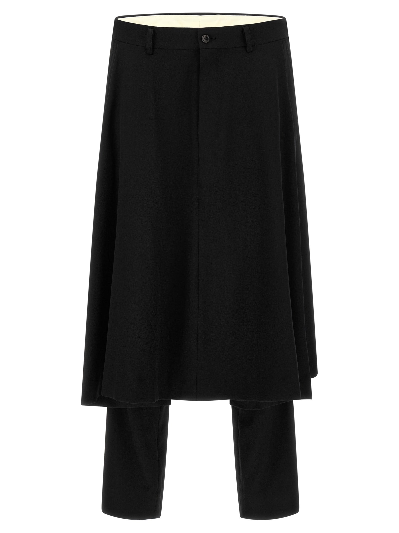 Experience the avant-garde elegance of Comme des Garçons Homme Plus trousers, crafted from pure black wool, merging bold design with timeless sophistication for the discerning individual.