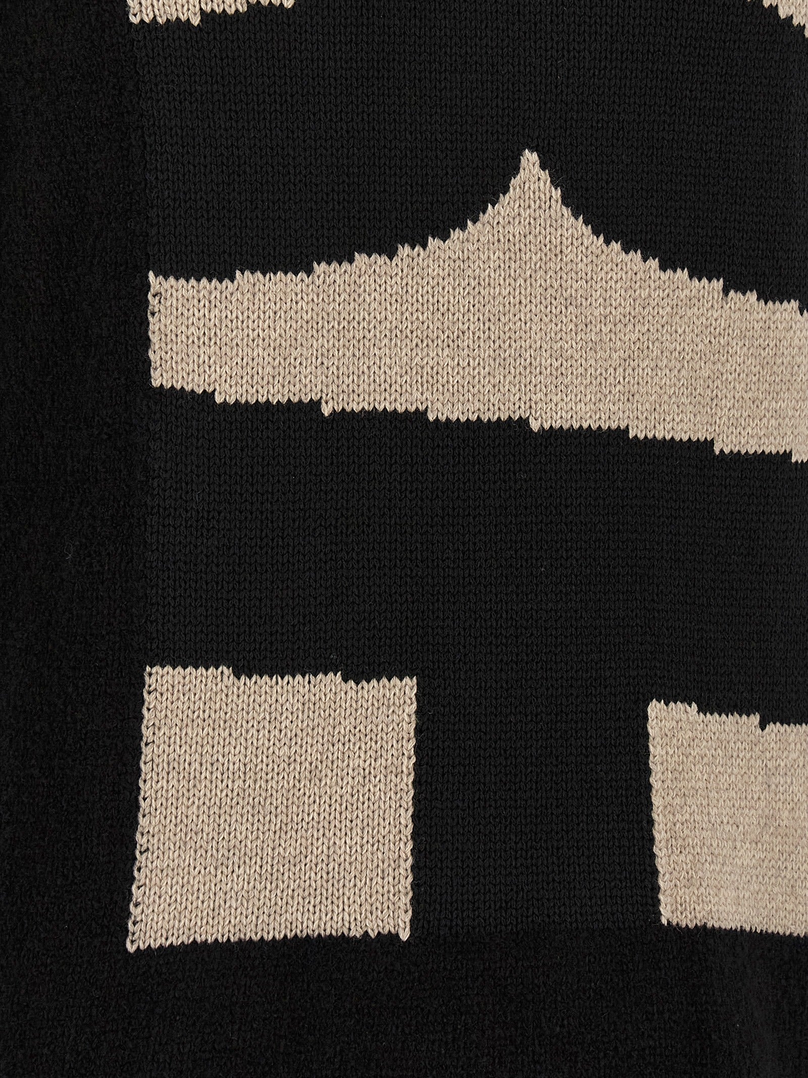 Elevate your wardrobe with the Comme Des Garçons Black Polyester Cardigan, a masterpiece of avant-garde design and luxurious comfort, crafted for the discerning individual.