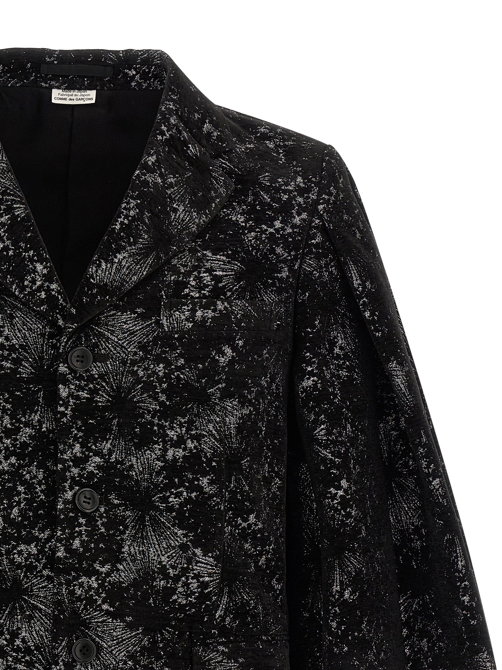 Experience the avant-garde elegance of the Comme Des Garçons Black Polyester Blazer, a masterful blend of artistry and sophistication, perfect for the discerning individual.