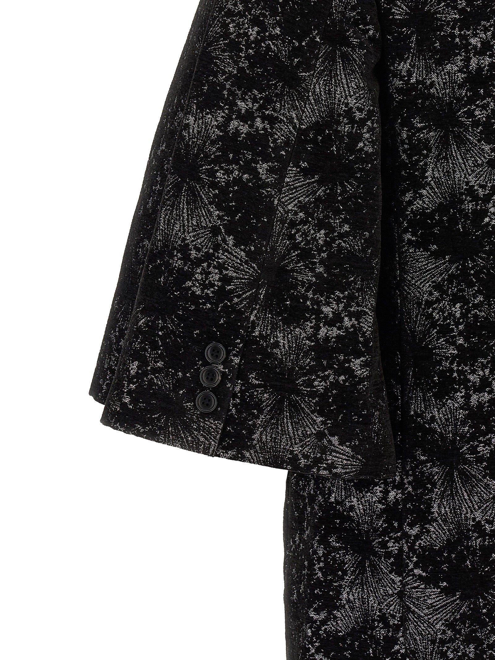 Discover the avant-garde allure of the Comme Des Garçons Black Polyester Blazer, a masterpiece of tailored sophistication and unique design, perfect for the discerning fashion connoisseur.