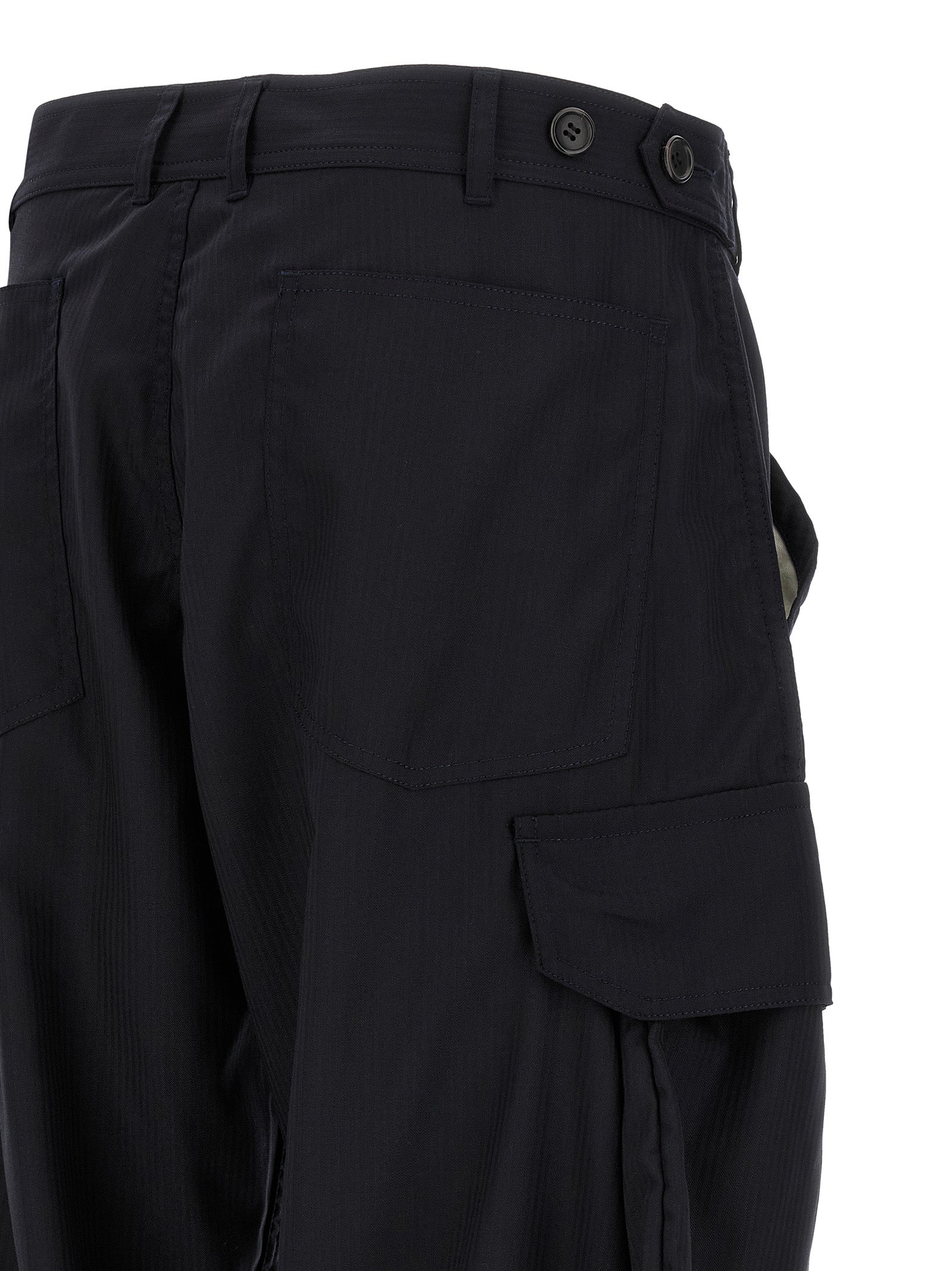 Experience the allure of Comme Des Garçons Blue Polyester Cargo Pants, where innovative design meets refined craftsmanship, elevating your wardrobe with unparalleled sophistication.
