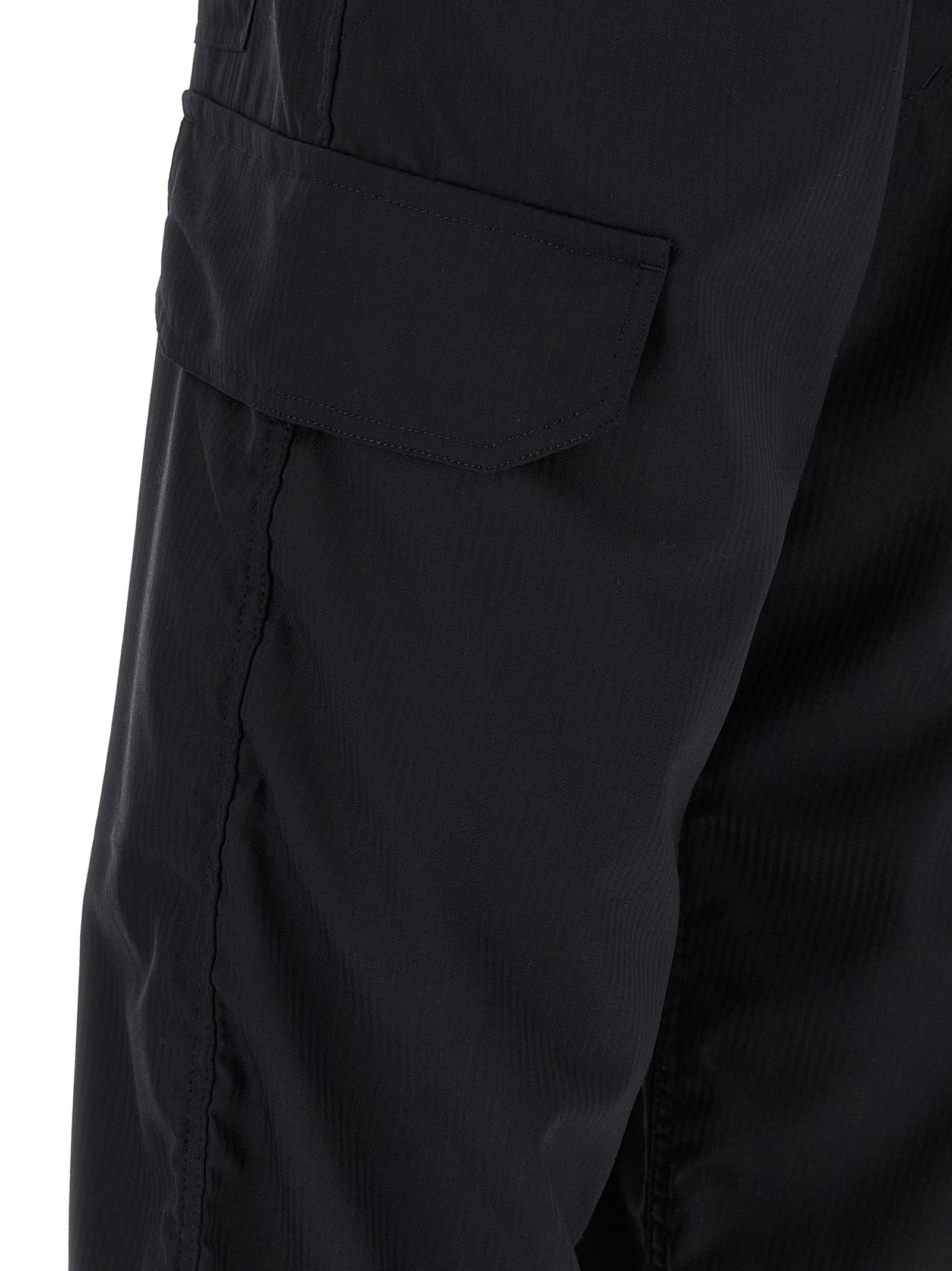 Experience the allure of Comme Des Garçons Blue Polyester Cargo Pants, where innovative design meets refined craftsmanship, elevating your wardrobe with unparalleled sophistication.