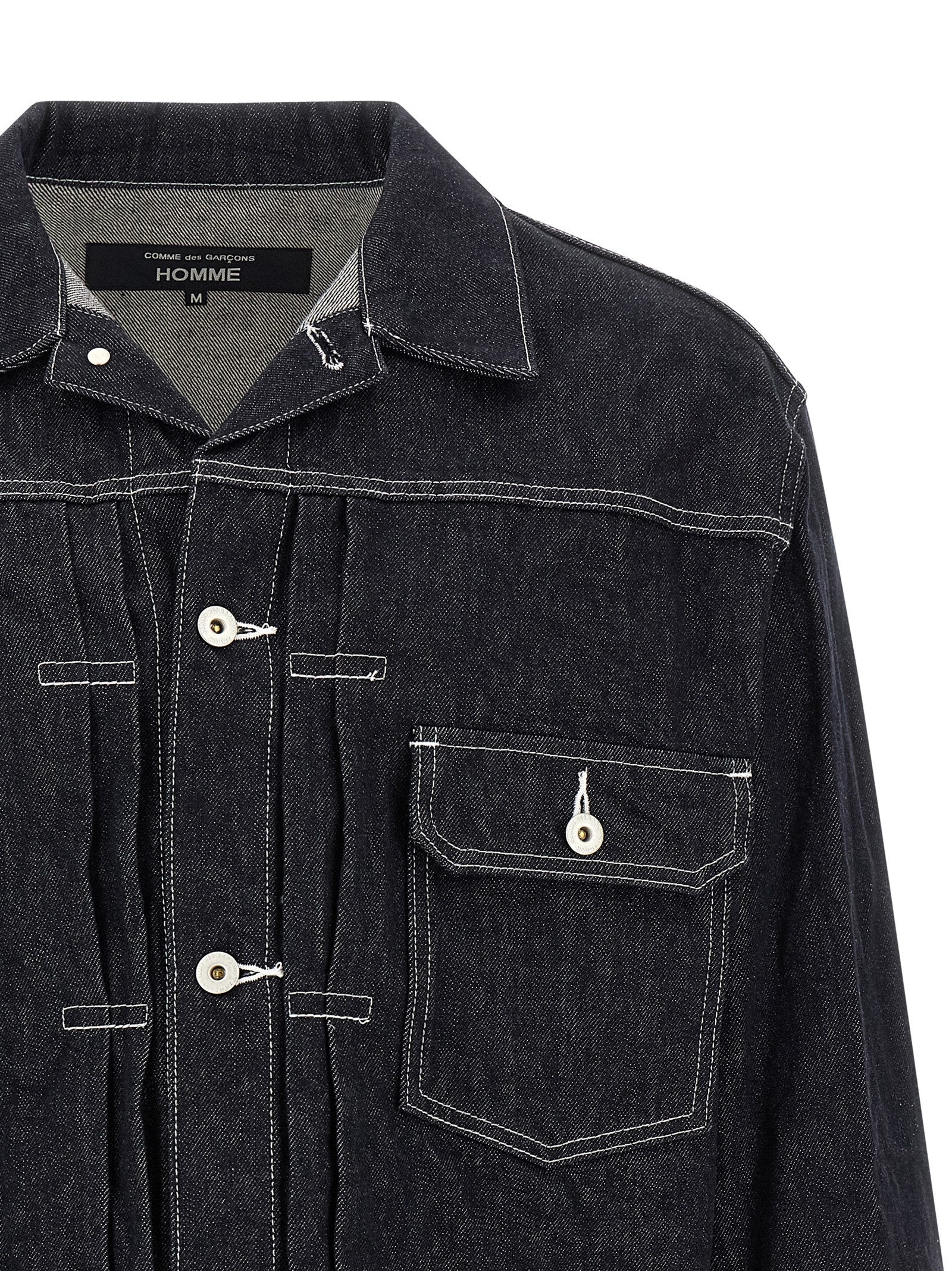 Discover the Comme Des Garçons Blue Cotton Denim Jacket, a masterpiece of avant-garde design and Japanese craftsmanship, perfect for those who embody elegance and sophistication.
