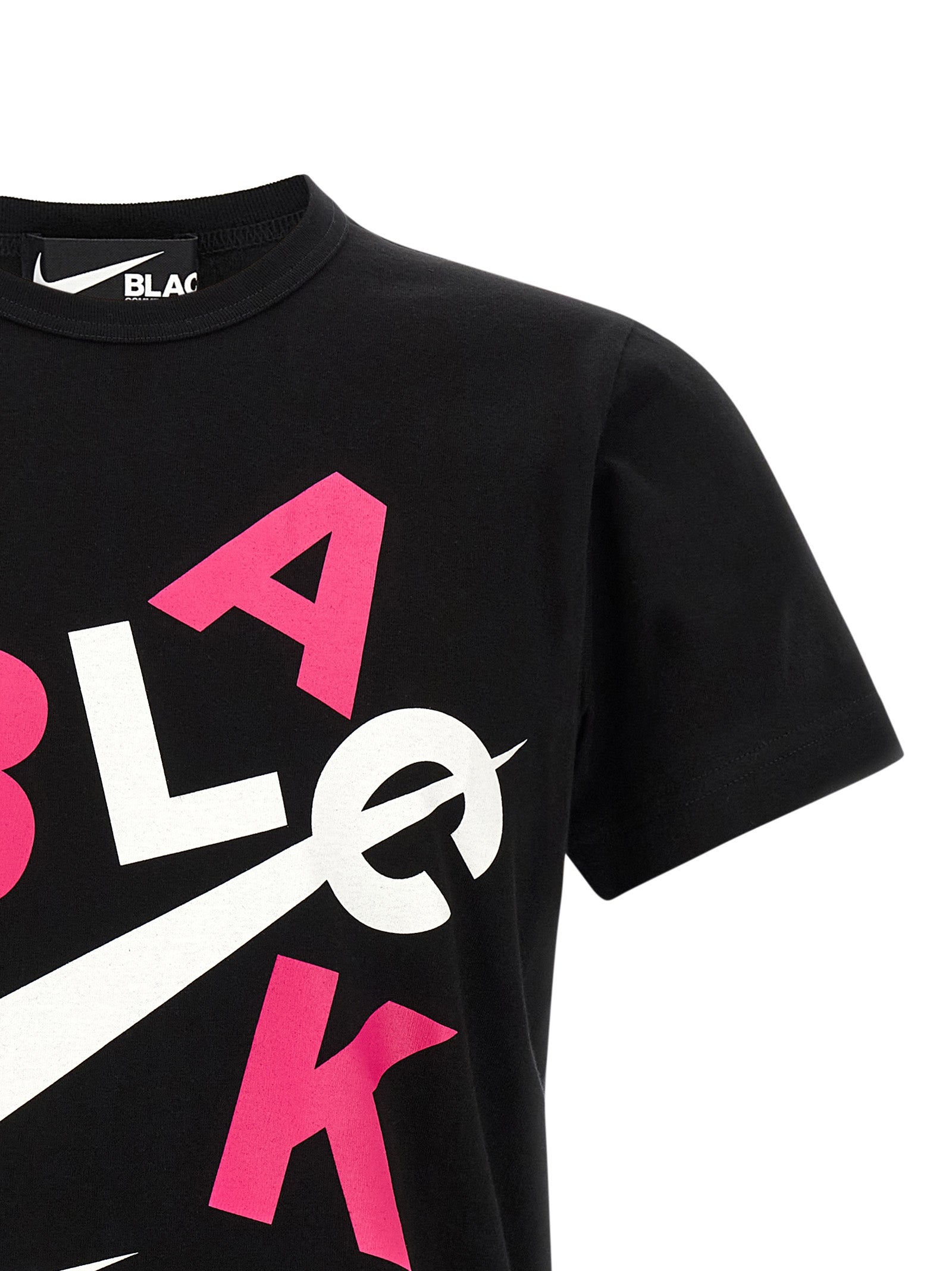 Elevate your style with the Comme Des Garçons Black Cotton T-Shirt, where avant-garde design meets luxurious comfort, perfect for the discerning connoisseur.