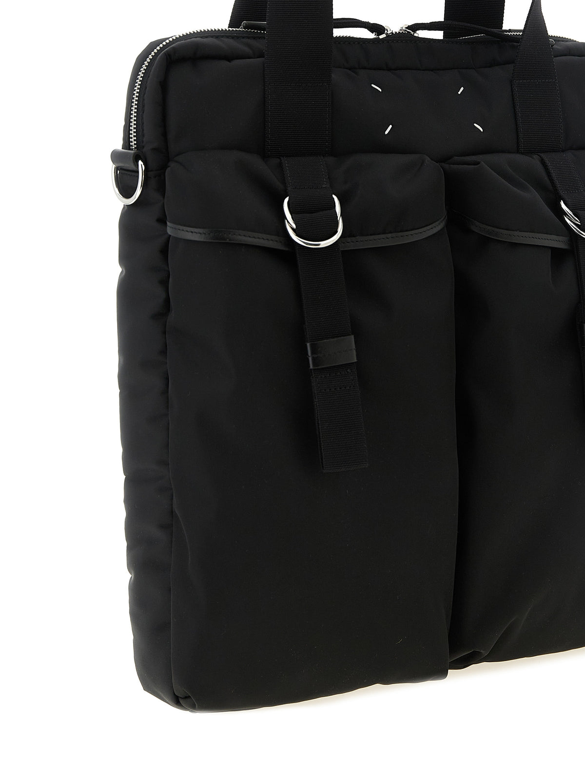 Discover the Maison Margiela Black Polyamide Tote Bag, a blend of industrial elegance and timeless allure, perfect for the discerning individual seeking unmatched sophistication.