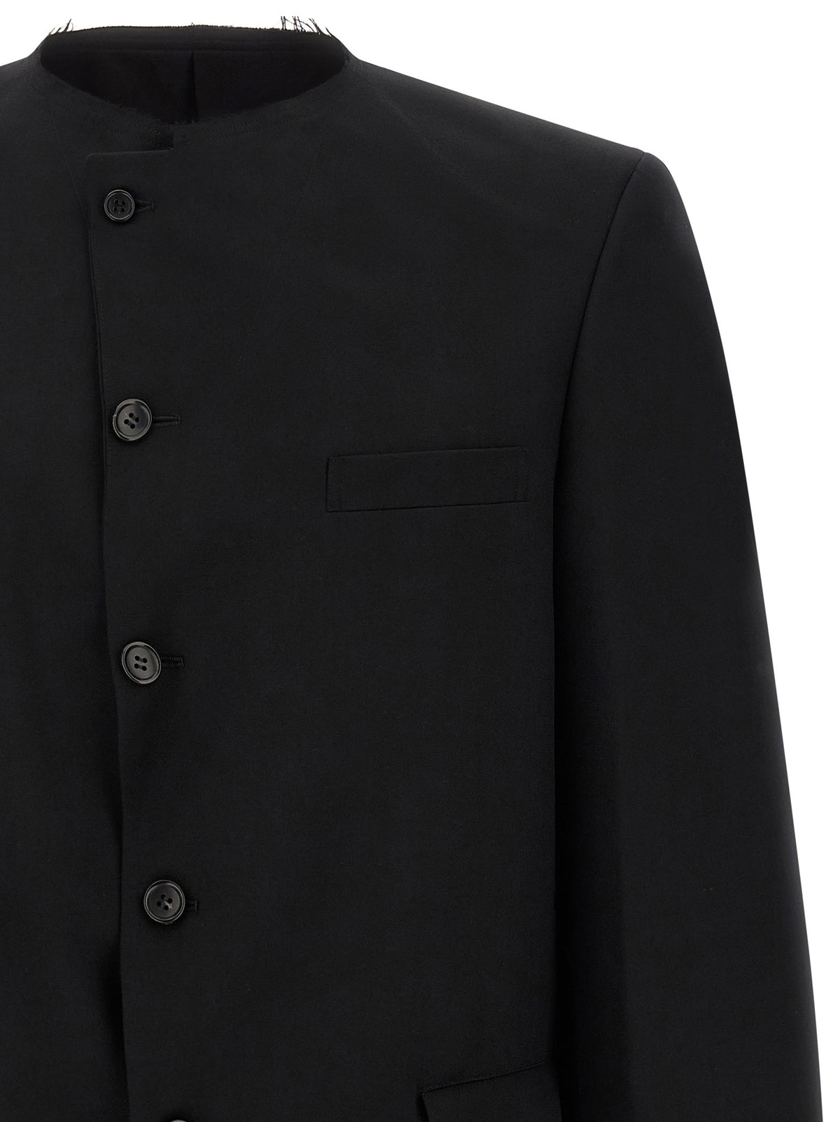 Elevate your style with the Comme Des Garçons Black Wool Blazer, a masterpiece of avant-garde design and luxurious Japanese craftsmanship, perfect for the discerning individual.