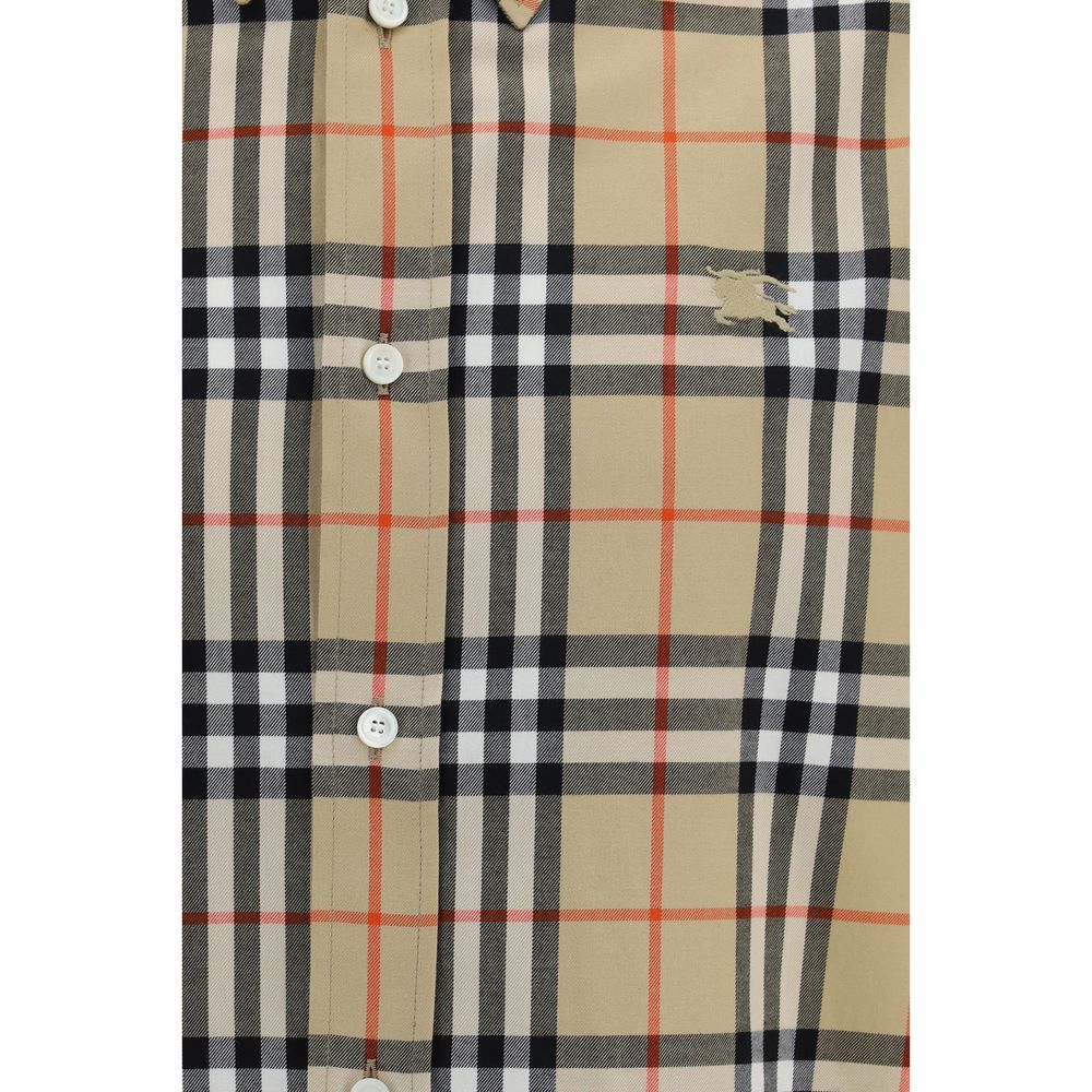 Elevate your wardrobe with the Burberry Check Cotton Shirt, a blend of iconic design and luxurious craftsmanship, perfect for those who embody sophistication and style.