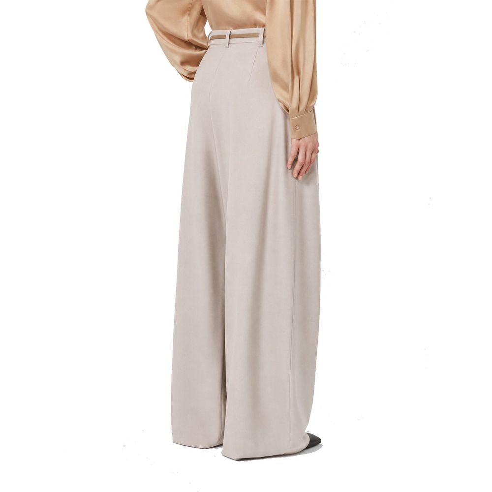 Indulge in the elegance of Max Mara's Beige Elastane Casual Pants, crafted from luxurious virgin wool, embodying sophistication and timeless allure for the discerning individual.