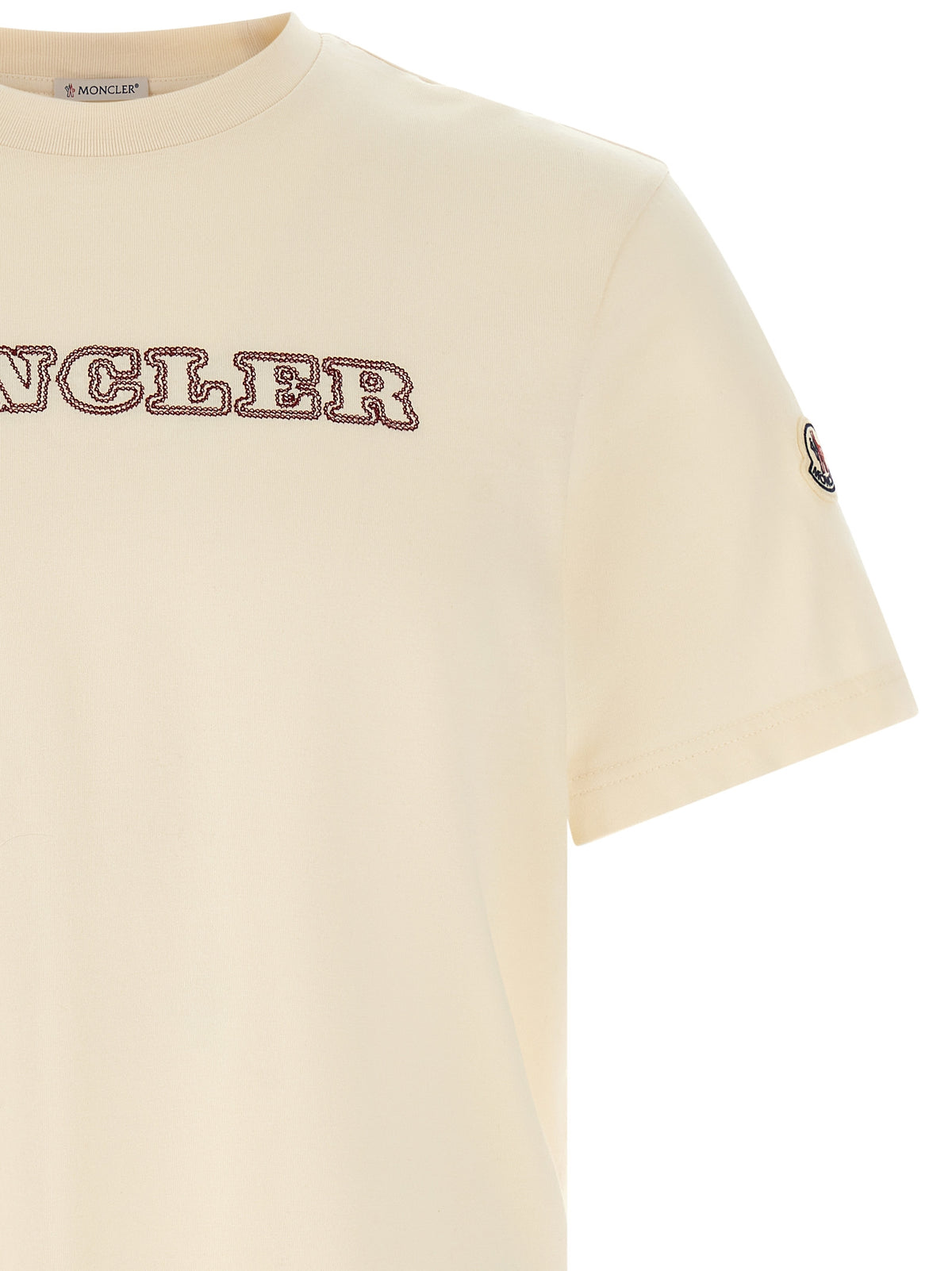 Indulge in the Moncler White Cotton T-Shirt, where impeccable craftsmanship meets a minimalistic aesthetic, redefining luxury for the discerning wardrobe.