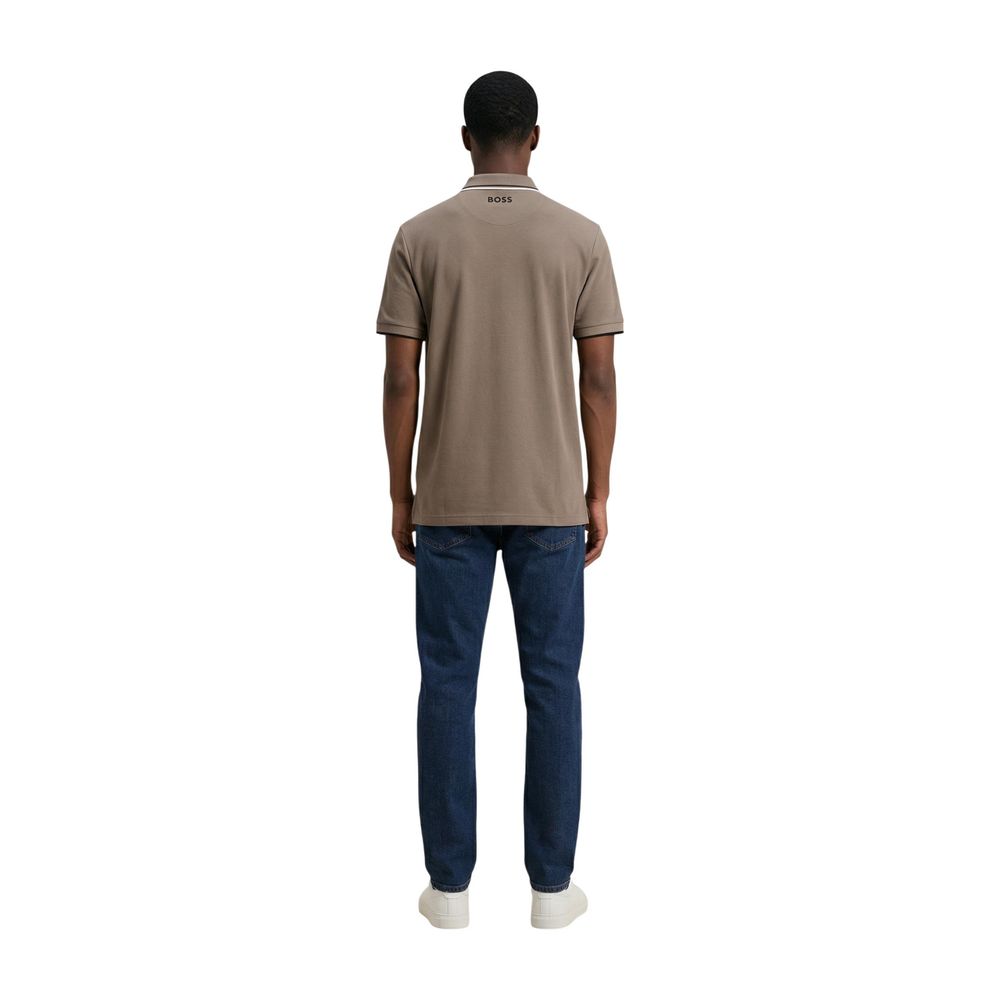 Indulge in the exquisite craftsmanship of the Hugo Boss Beige Cotton Polo Shirt, a perfect blend of elegance and comfort for the discerning individual.