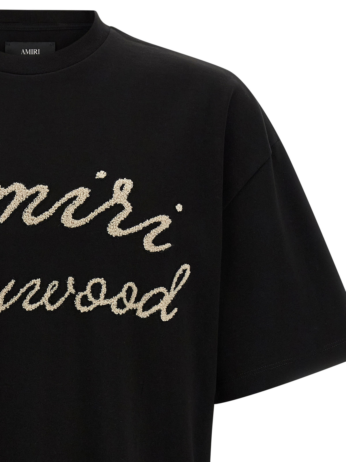 Elevate your wardrobe with the Amiri Black Cotton T-Shirt, a luxurious blend of contemporary allure and refined craftsmanship, perfect for the discerning individual.