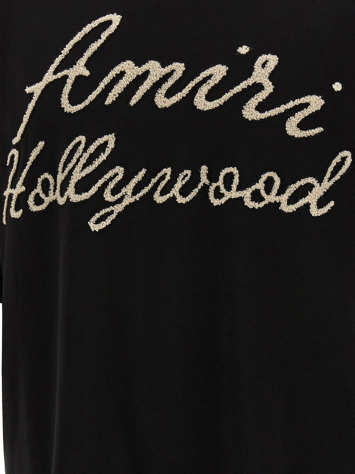 Elevate your wardrobe with the Amiri Black Cotton T-Shirt, a masterpiece of luxury streetwear that combines sophisticated design with pure cotton comfort, embodying contemporary allure.