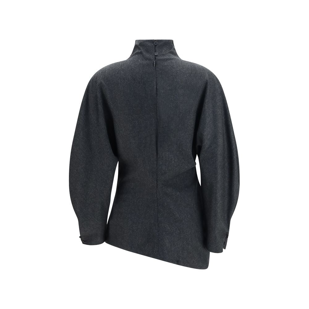Indulge in the exquisite Harlow wool-cashmere blouse by Khaite, where dynamic draping meets sculpted elegance, embodying luxury and sophistication for the discerning individual.