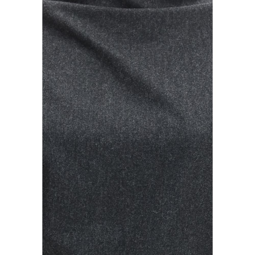 Indulge in the exquisite Harlow wool-cashmere blouse by Khaite, where dynamic draping meets refined elegance, perfect for the discerning connoisseur of luxury.