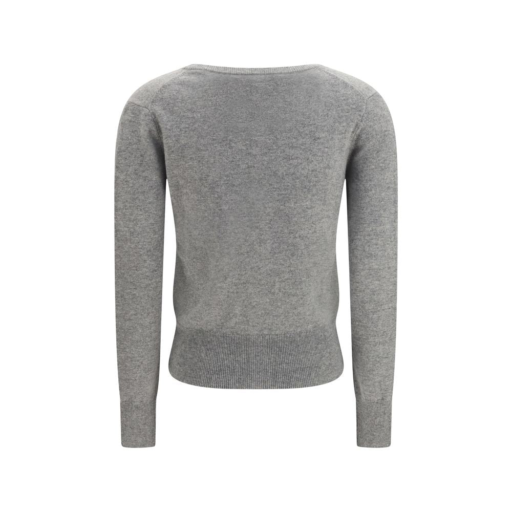 Indulge in the exquisite N°511 Dorothea Cardigan by Extreme Cashmere, crafted from pure cashmere, embodying timeless elegance and luxurious comfort for the discerning individual.