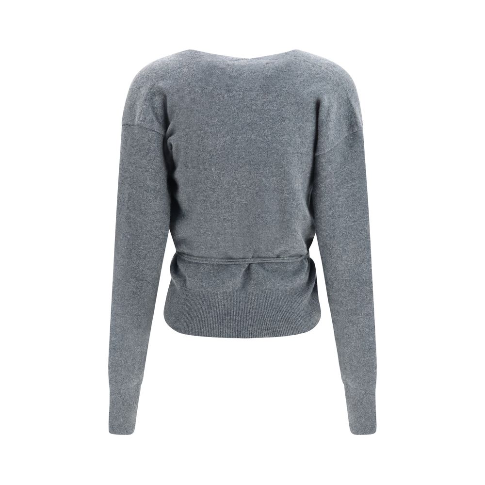 Indulge in the exquisite N°516 Ella Cardigan by Extreme Cashmere, crafted from sumptuous cashmere for an effortlessly elegant silhouette that embodies timeless luxury.