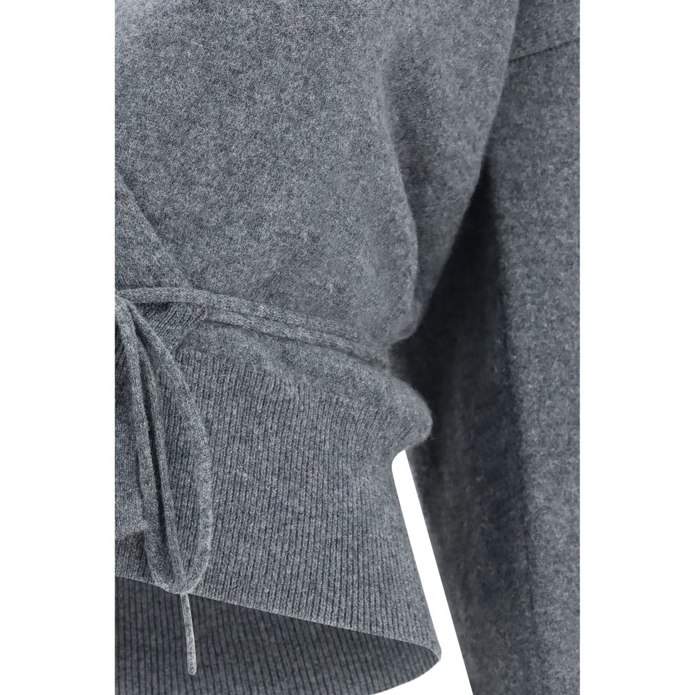 Indulge in the exquisite N°516 Ella Cardigan by Extreme Cashmere, crafted from luxurious cashmere for a refined silhouette that embodies timeless elegance.