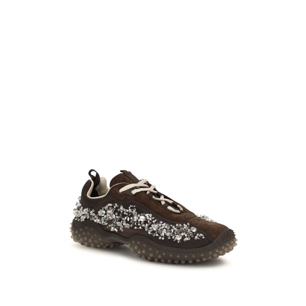 Indulge in the exquisite Miu Miu Brown Suede Leather Sneakers, where luxurious suede meets sparkling crystals, elevating your style with unparalleled sophistication.