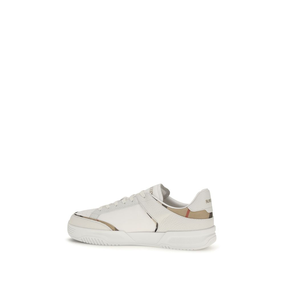 Elevate your style with Burberry's White Calf Leather Bos Taurus Low Top Sneakers, where exquisite craftsmanship meets timeless elegance for the discerning individual.