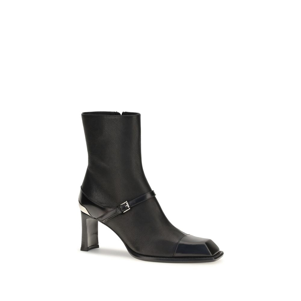 Elevate your style with Alexander McQueen's Niko Ankle Boots, crafted from sumptuous black lamb leather, embodying refined luxury and timeless sophistication.