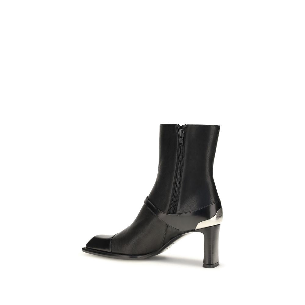 Indulge in the exquisite Niko Ankle Boots by Alexander McQueen, crafted from sumptuous black lamb leather, where refined elegance meets bold design for the discerning individual.
