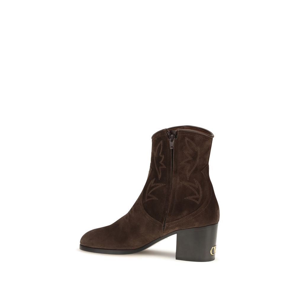 Indulge in the exquisite Zimmy suede ankle boots by Valentino Garavani, where Italian craftsmanship meets timeless elegance, perfect for the discerning individual.