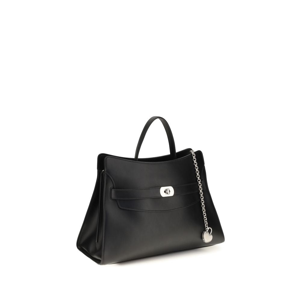 Indulge in the architectural elegance of the Alexander McQueen Black Calf Leather Bos Taurus Shoulder Bag, a masterpiece of Italian craftsmanship that elevates your style with timeless luxury.
