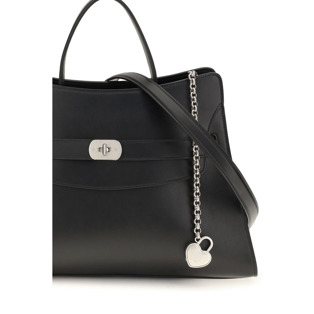 Discover the Alexander McQueen Black Calf Leather Bos Taurus Shoulder Bag, an exquisite blend of architectural elegance and functional luxury, crafted in Italy.