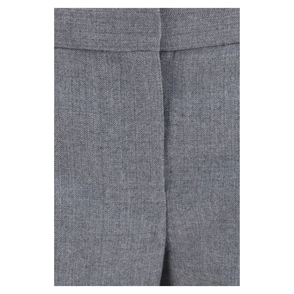 Elevate your wardrobe with Alexander McQueen's Gray Wool Oves Aries Casual Pants, crafted from luxurious Merino wool for a sophisticated, tailored silhouette.