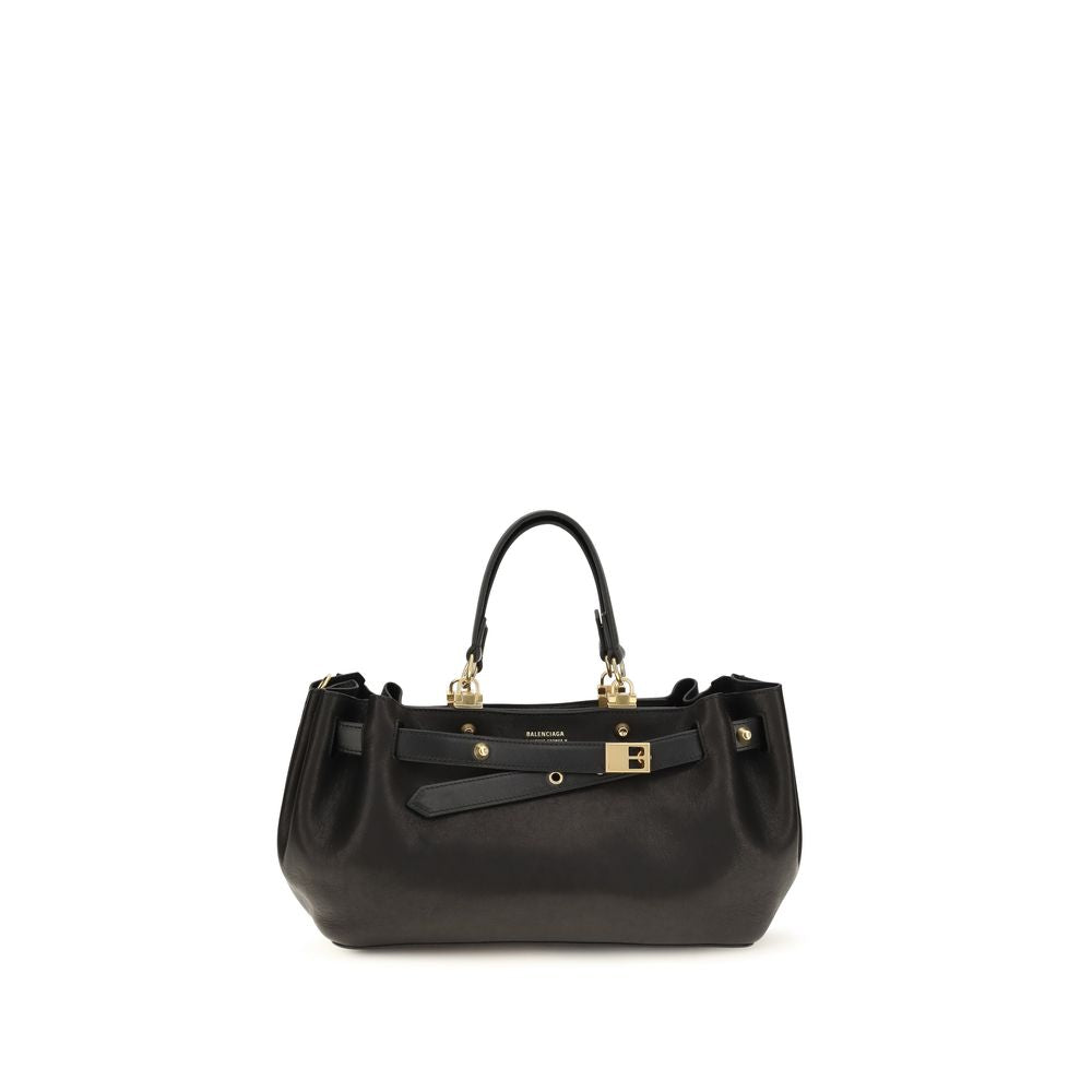 Indulge in the exquisite Balenciaga Black Calf Leather Bos Taurus Shoulder Bag, a masterpiece of Italian craftsmanship that elevates your style with its luxurious silhouette and timeless elegance.